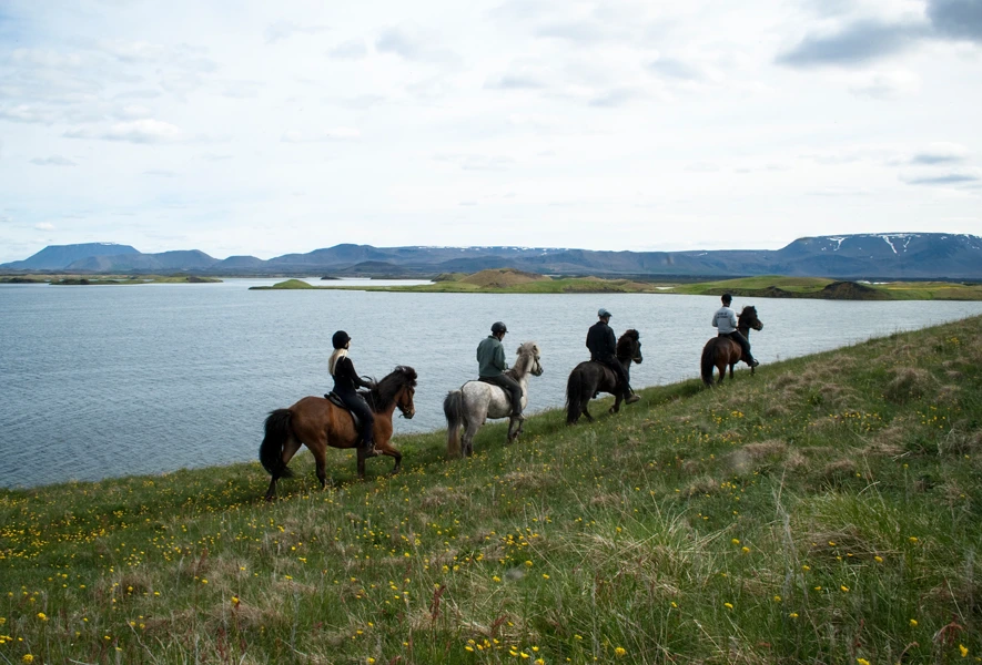 Riding by lake Mývatn.